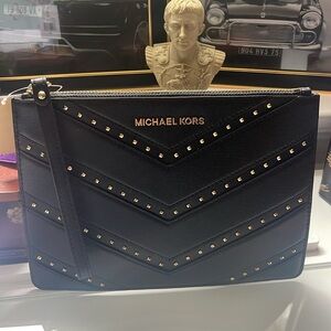 New with tag Michael Kors black leather Ellis XL Zip Clutch Wristlet.